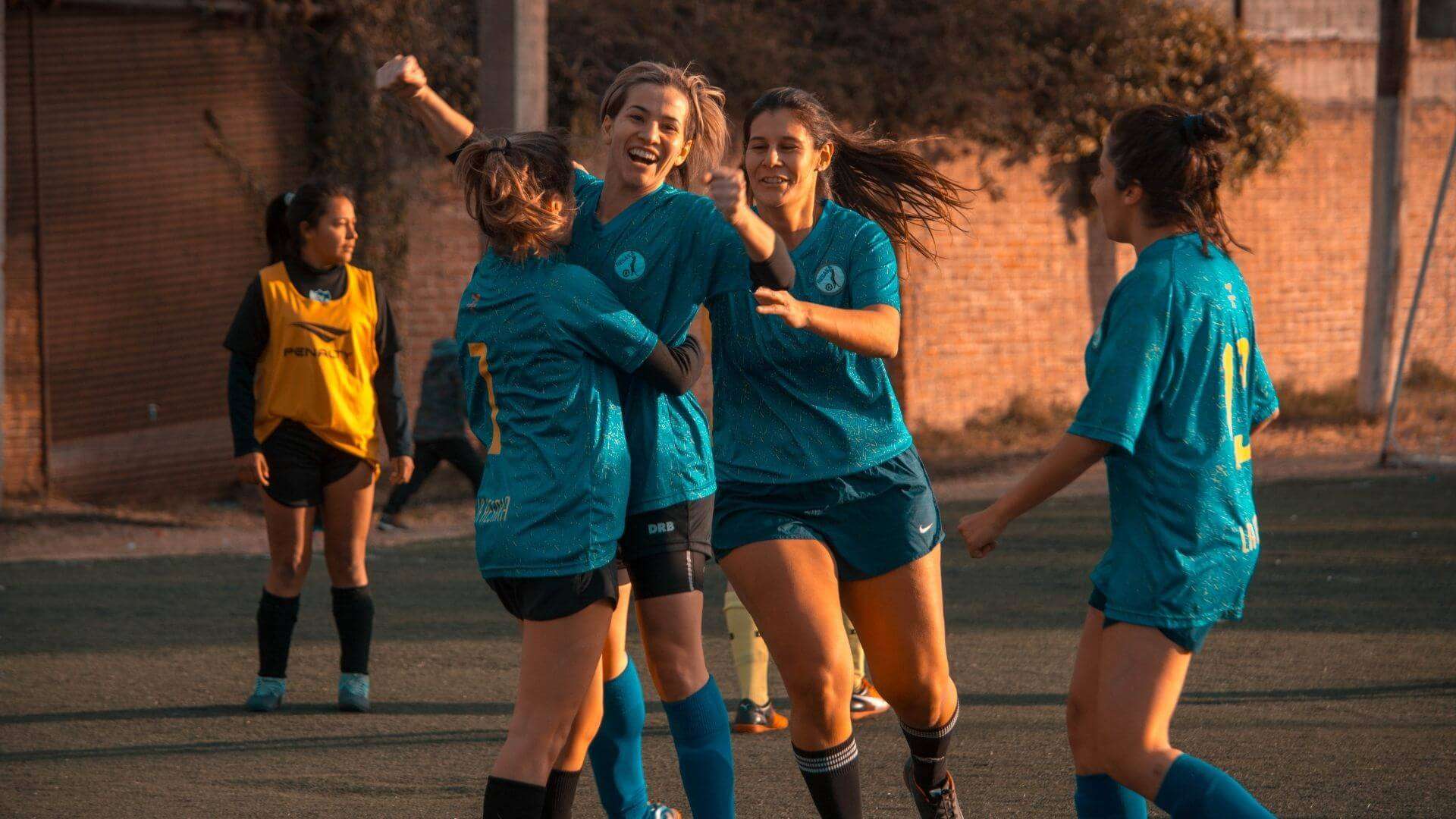 girls celebrating at soccer game