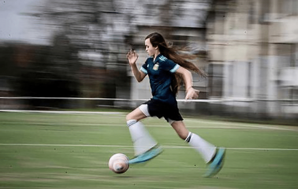 Zoe Puente playing soccer