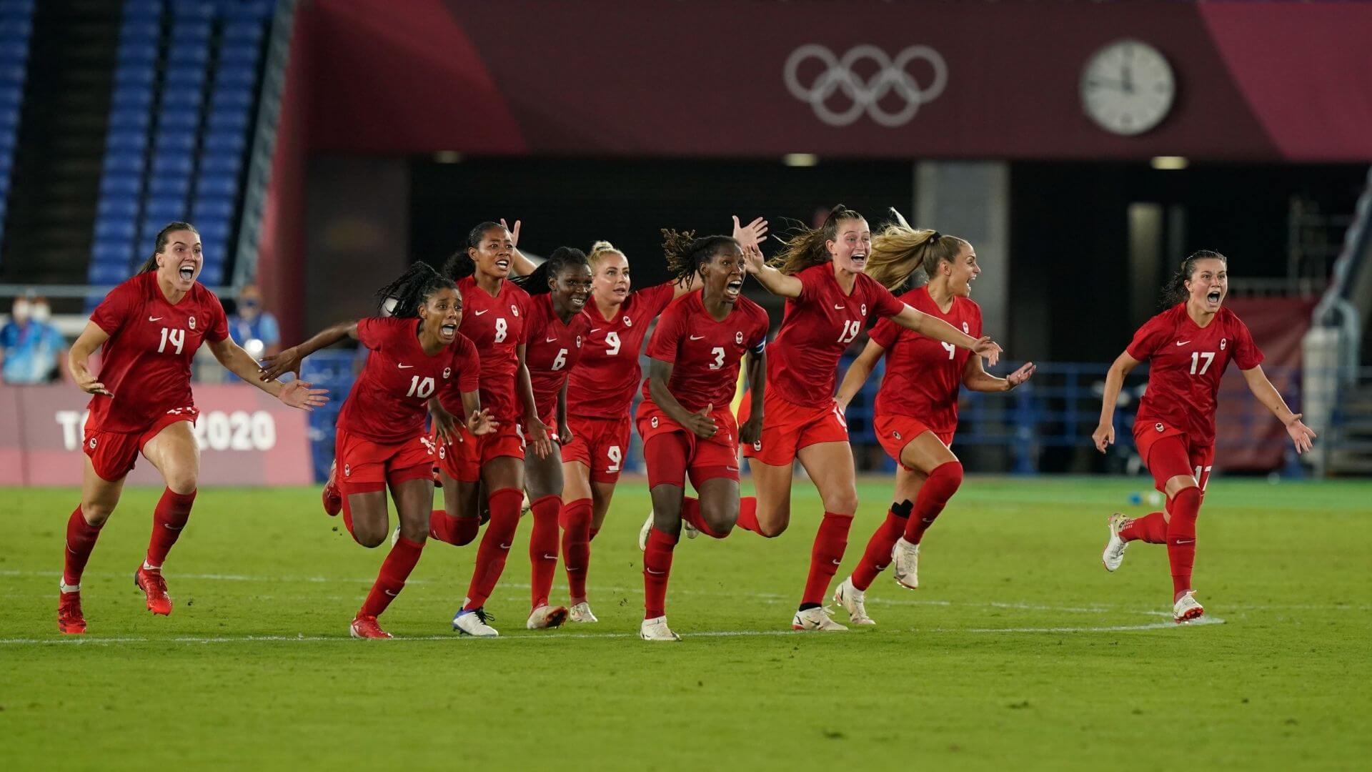 Canada celebrates after their first time ever winning Olympic gold.