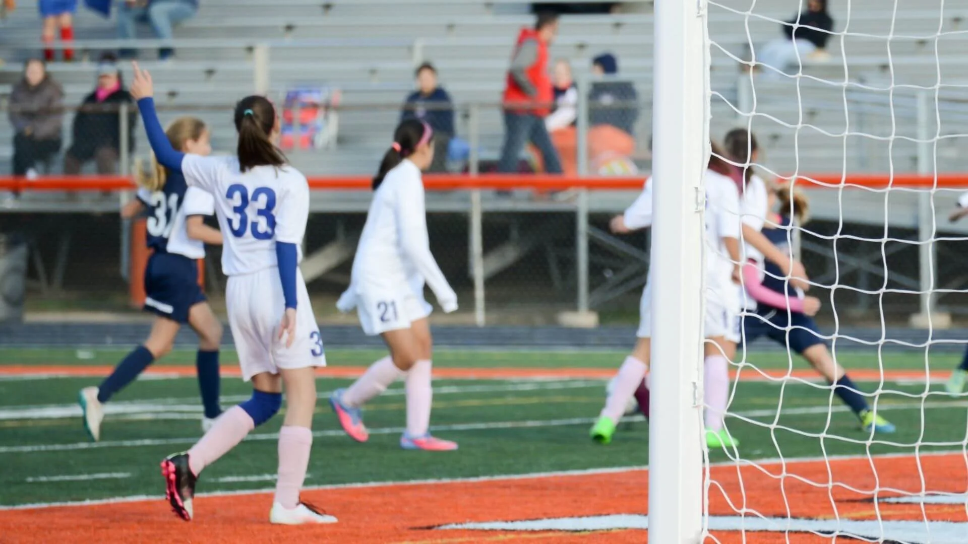 Girls soccer player communicating