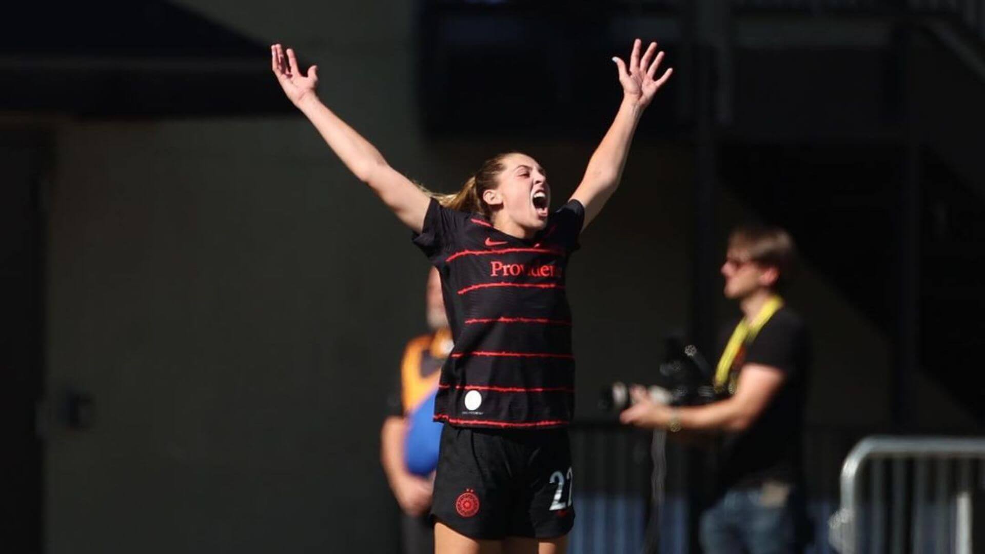 Morgan Weaver celebrating a goal, as seen in this week's women's soccer news